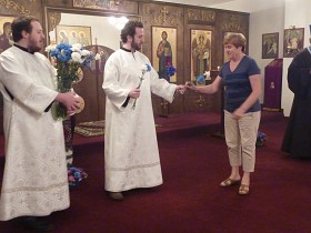Parishioners receive blessed flowers